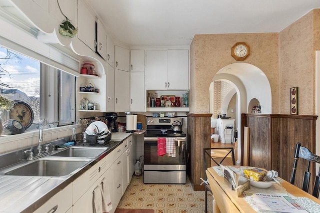 kitchen featuring white cabinetry, sink, and stainless steel electric stove