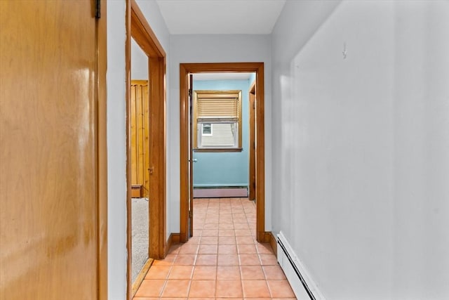 hallway with a baseboard radiator, baseboards, baseboard heating, and light tile patterned floors