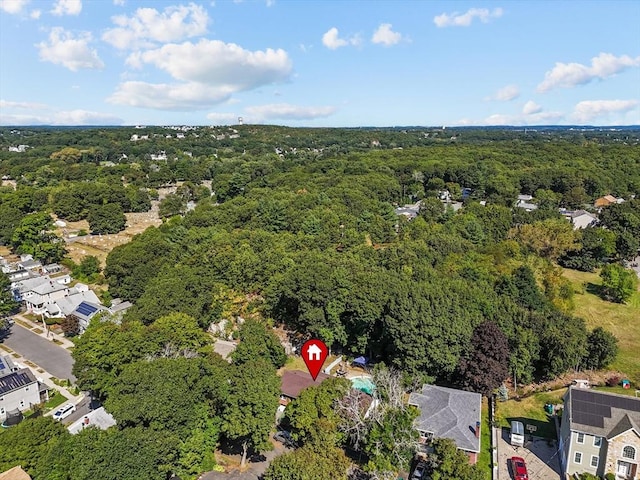 birds eye view of property with a residential view and a wooded view