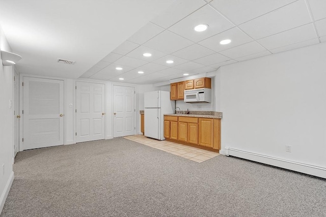 kitchen with visible vents, white appliances, light colored carpet, recessed lighting, and a baseboard radiator