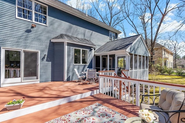 wooden terrace featuring a sunroom