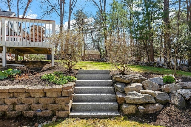 view of yard featuring stairs and a deck