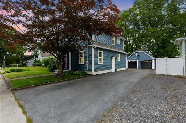 45 Curtis Ave, Attleboro, MA 02703 - property exterior at dusk with an outdoor structure, a garage, and a gate