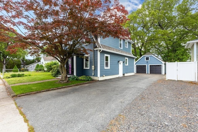 45 Curtis Ave, Attleboro, MA 02703 - view of front facade featuring an outbuilding, a detached garage, a gate, and a shingled roof