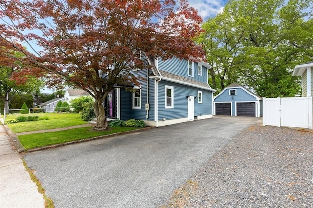 45 Curtis Ave, Attleboro, MA 02703 - view of side of home with an outbuilding, a detached garage, a gate, and roof with shingles
