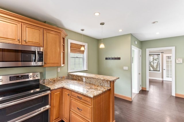 45 Curtis Ave, Attleboro, MA 02703 - kitchen with stainless steel appliances, a peninsula, light stone counters, baseboards, and recessed lighting