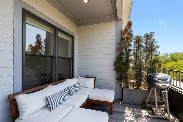 balcony featuring an outdoor hangout area and a grill