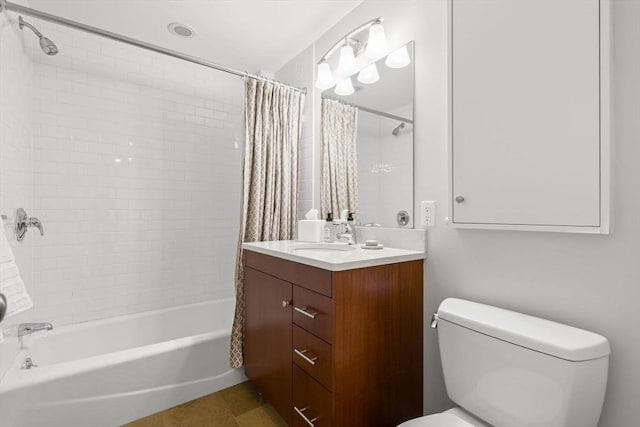 bathroom featuring toilet, shower / bathtub combination with curtain, and vanity