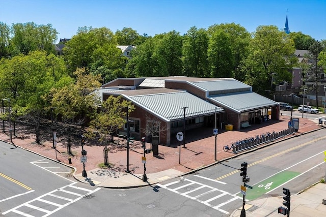 view from above of property featuring a tree filled landscape