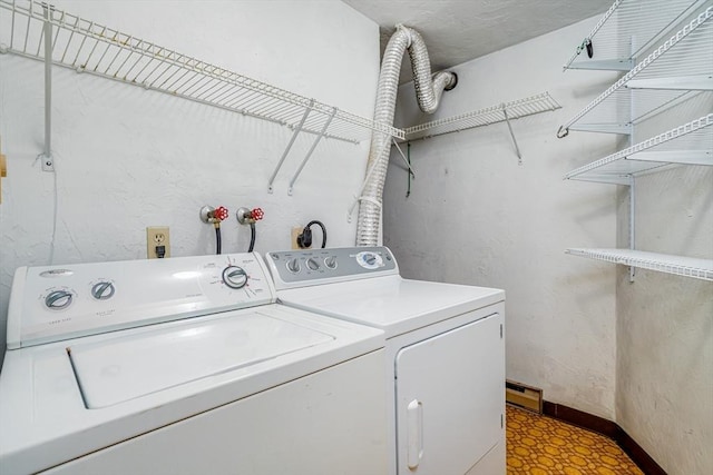 laundry room with washing machine and clothes dryer