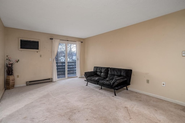 sitting room with a baseboard heating unit and light carpet