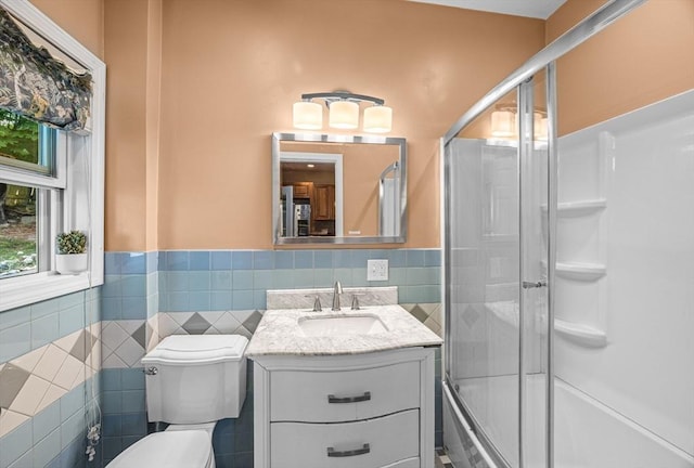 34 Prout St, Quincy, MA 02169 - full bathroom with tile walls, a wainscoted wall, vanity, toilet, and shower / bath combination with glass door