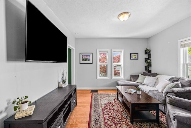 34 Prout St, Quincy, MA 02169 - living room with light wood-style flooring and baseboards