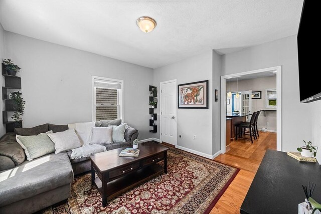 34 Prout St, Quincy, MA 02169 - living area with light wood finished floors and baseboards