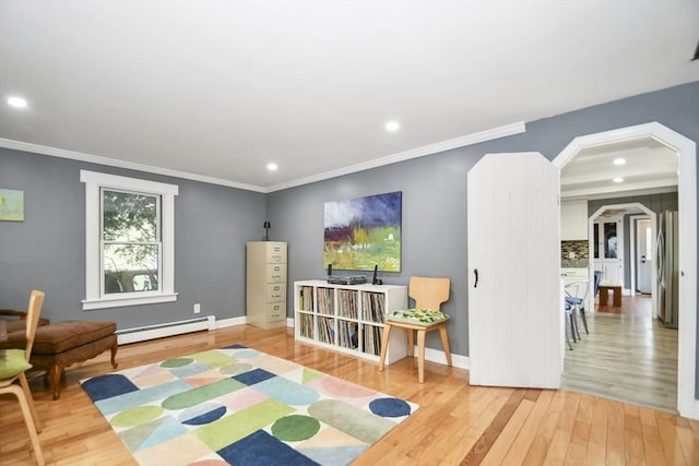 living room with light wood finished floors, crown molding, a baseboard heating unit, and recessed lighting