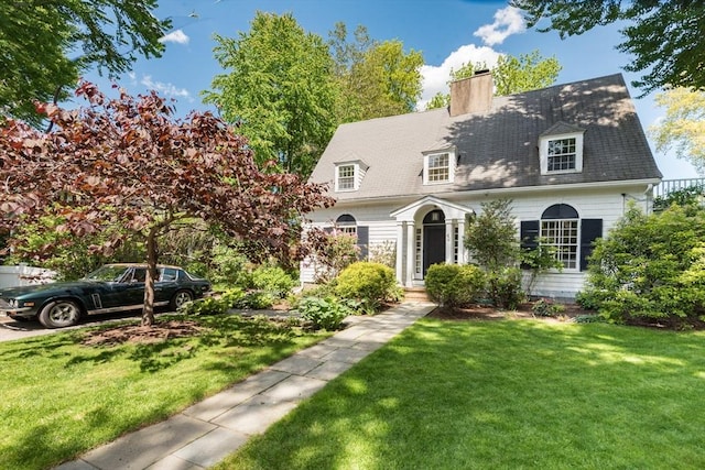 40 Stone Rd, Belmont, MA 02478 - cape cod-style house with a chimney and a front lawn