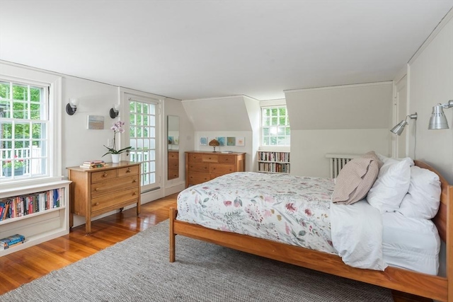 40 Stone Rd, Belmont, MA 02478 - bedroom featuring wood finished floors, multiple windows, and access to outside