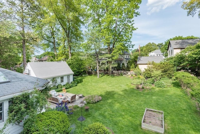 40 Stone Rd, Belmont, MA 02478 - view of green lawn with a vegetable garden and a residential view