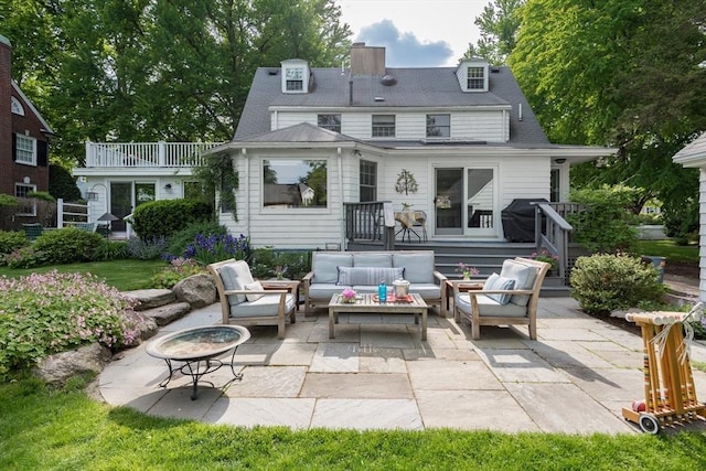 40 Stone Rd, Belmont, MA 02478 - rear view of house featuring an outdoor living space, a patio area, and a chimney