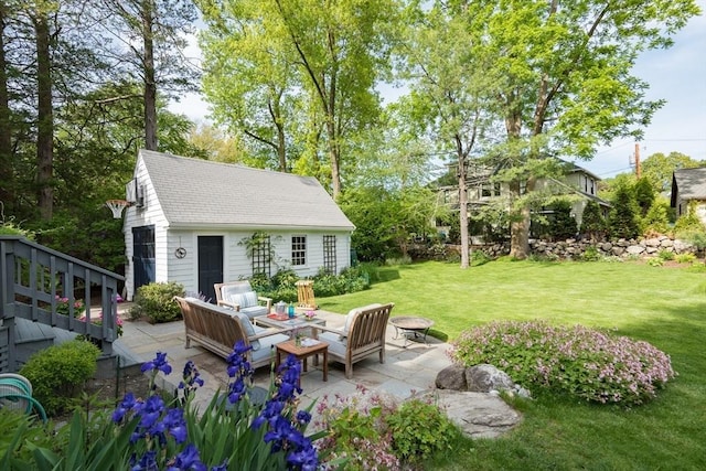 40 Stone Rd, Belmont, MA 02478 - view of green lawn with a patio area, an outbuilding, and an outdoor living space