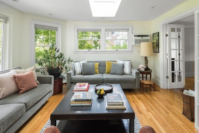 40 Stone Rd, Belmont, MA 02478 - living room featuring a wall mounted air conditioner, healthy amount of natural light, and light wood finished floors