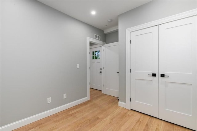 755 Boylston St Unit 2, Brookline, MA 02467 - unfurnished bedroom featuring light wood-style floors, baseboards, a closet, and recessed lighting