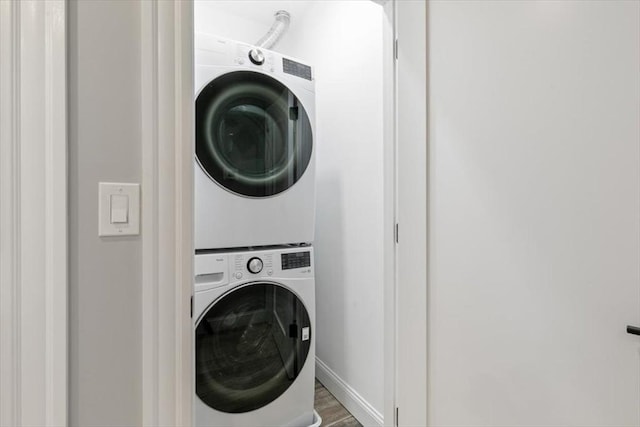 755 Boylston St Unit 2, Brookline, MA 02467 - laundry area with stacked washer / drying machine, wood finished floors, and baseboards
