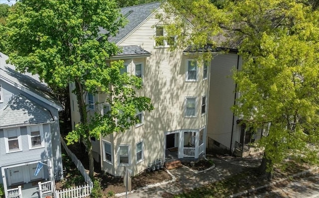 755 Boylston St Unit 2, Brookline, MA 02467 - view of property exterior with fence and a shingled roof