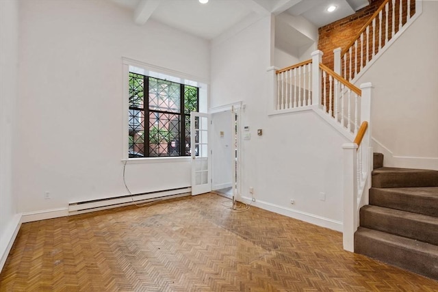 100-1/2 W Springfield St, Boston, MA 02118 - foyer entrance with baseboard heating, stairs, baseboards, beamed ceiling, and a towering ceiling