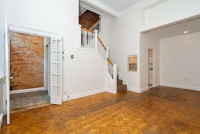 100-1/2 W Springfield St, Boston, MA 02118 - foyer entrance featuring a high ceiling, stairway, and baseboards