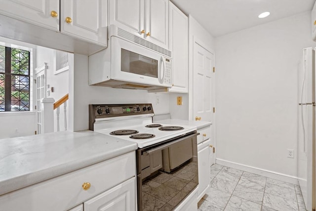 100-1/2 W Springfield St, Boston, MA 02118 - kitchen with white appliances, light countertops, light marble finish floors, white cabinets, and baseboards