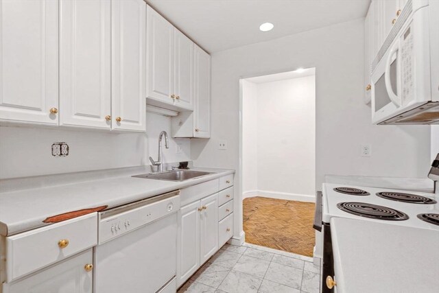 100-1/2 W Springfield St, Boston, MA 02118 - kitchen with white appliances, a sink, light countertops, white cabinetry, and baseboards