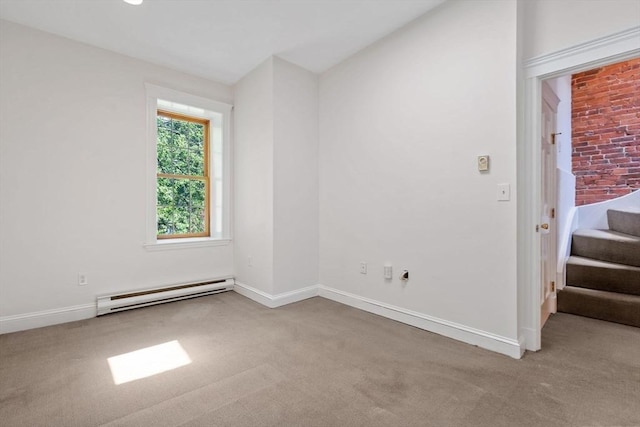 100-1/2 W Springfield St, Boston, MA 02118 - carpeted empty room with a baseboard radiator, stairway, baseboards, and vaulted ceiling