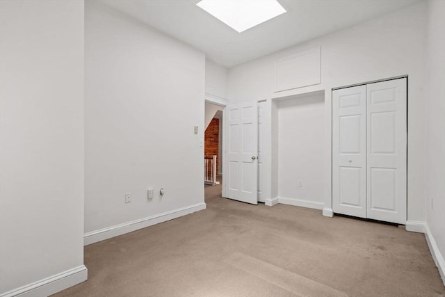 100-1/2 W Springfield St, Boston, MA 02118 - unfurnished bedroom with light carpet, a skylight, and baseboards