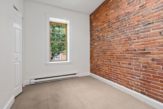 100-1/2 W Springfield St, Boston, MA 02118 - spare room with baseboard heating, carpet flooring, brick wall, and baseboards