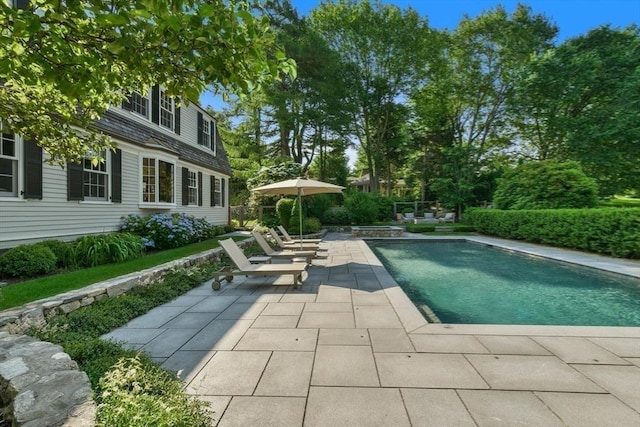 pool featuring a patio area and fence