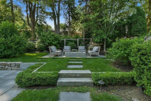 view of yard with a patio area, outdoor lounge area, and fence