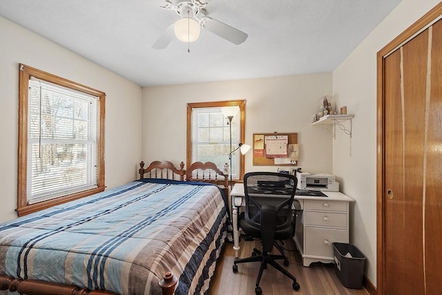 bedroom featuring light wood finished floors and ceiling fan