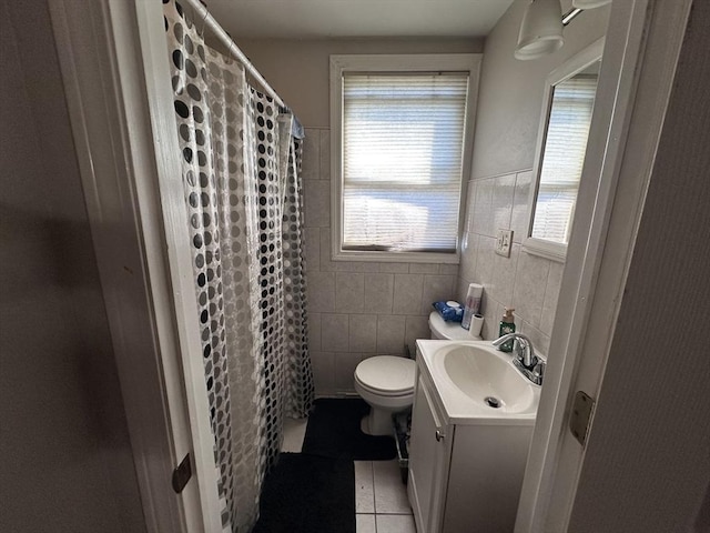 full bathroom with tile patterned floors, tile walls, vanity, toilet, and a shower with curtain