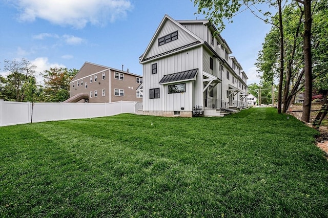 1514 Gorham St Unit 2, Lowell, MA 01852 - rear view of house featuring board and batten siding
