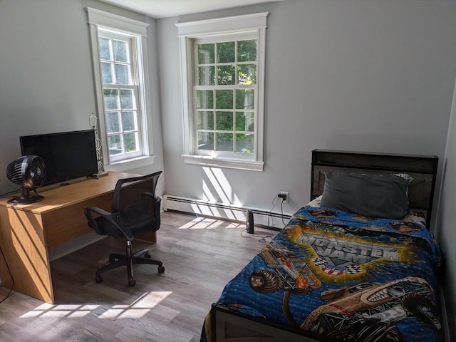 134 Mountain Rd, Princeton, MA 01541 - bedroom with a baseboard radiator, wood finished floors, and a desk