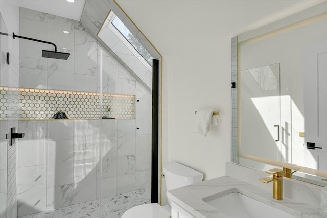 full bath featuring vanity, a marble finish shower, and toilet