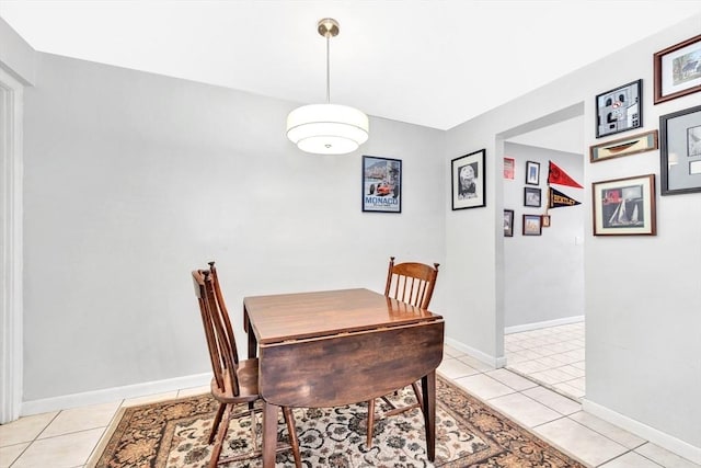 dining area with light tile patterned floors