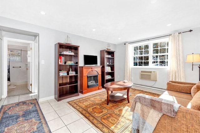 living room featuring light tile patterned floors, baseboard heating, and a wall mounted AC