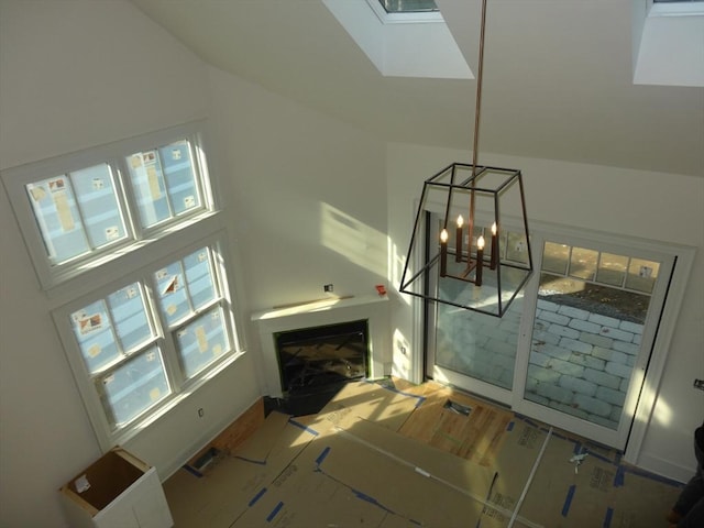 interior space with wood-type flooring and a notable chandelier