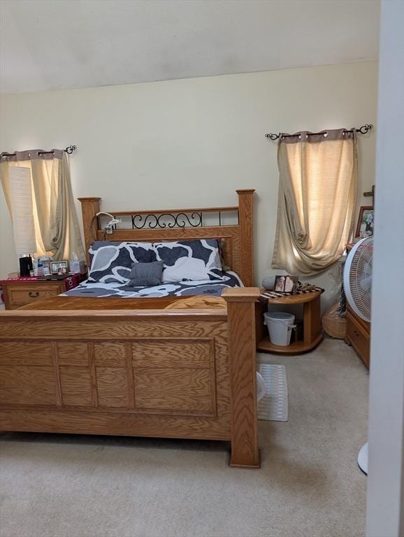 bedroom featuring light carpet