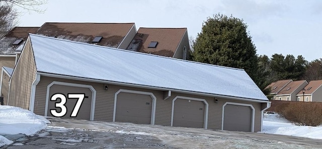 view of snow covered garage