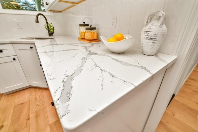 room details with wood finished floors and a sink