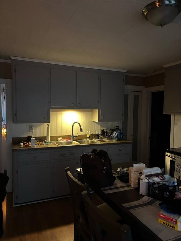 12 Woodmont St, Westfield, MA 01085 - kitchen featuring a sink and crown molding