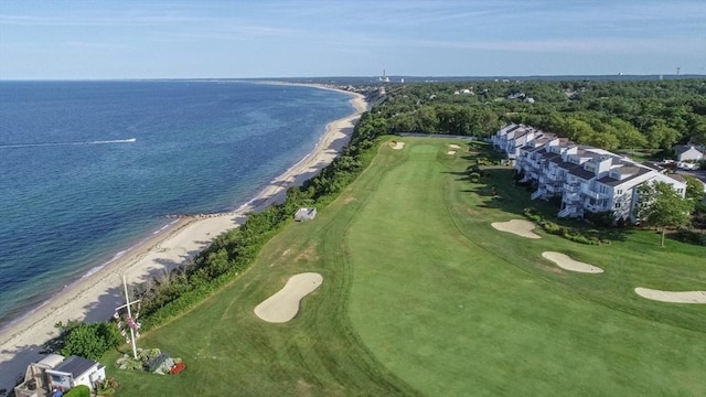 bird's eye view featuring a water view and a beach view